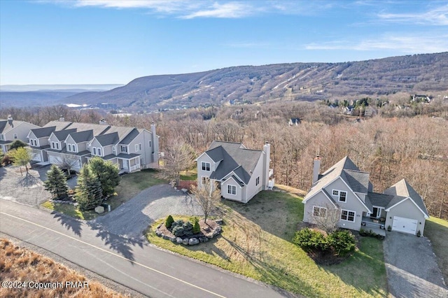 birds eye view of property with a mountain view and a residential view