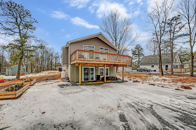 view of front of property with an outbuilding and a deck