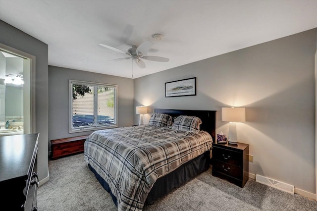 carpeted bedroom with baseboards, visible vents, and a ceiling fan