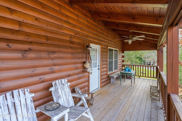 wooden terrace featuring a ceiling fan