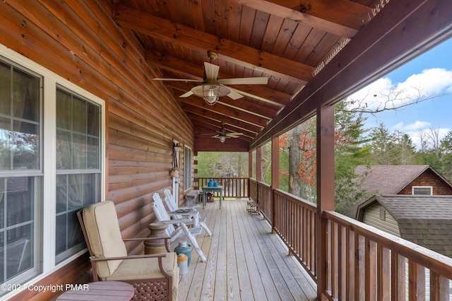 deck with a porch and a ceiling fan