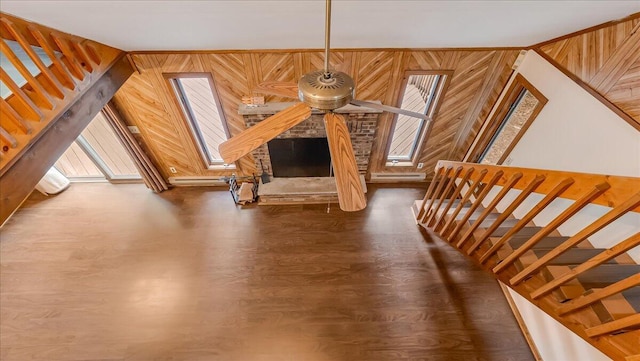 5913 NE Decker Rd NE, Bushkill, PA 18324 - stairway featuring wood finished floors, wooden walls, and baseboard heating
