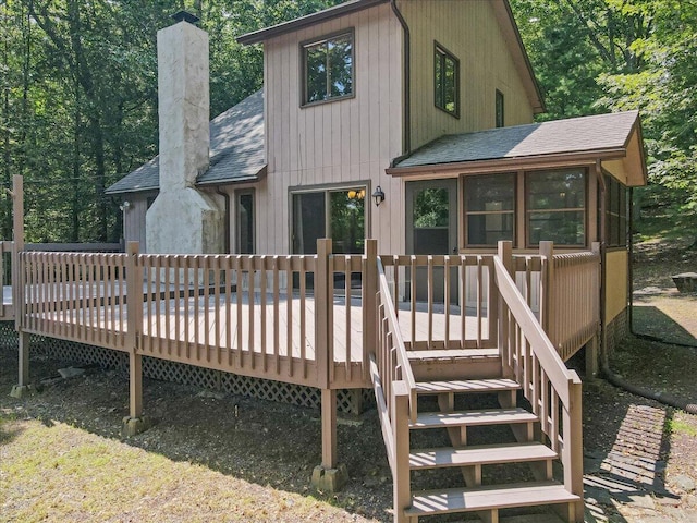 5913 NE Decker Rd NE, Bushkill, PA 18324 - rear view of property with a shingled roof, a chimney, and a wooden deck