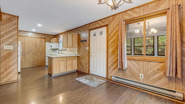 5913 NE Decker Rd NE, Bushkill, PA 18324 - kitchen with white appliances, a chandelier, wood walls, baseboard heating, and light countertops