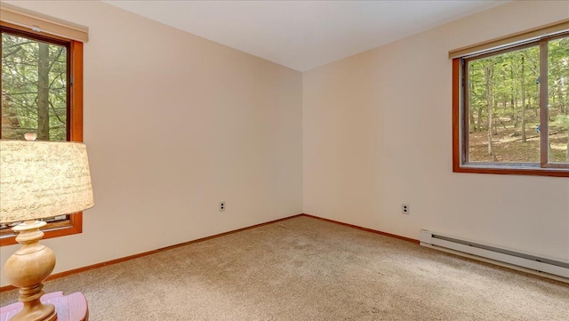 5913 NE Decker Rd NE, Bushkill, PA 18324 - empty room with a baseboard heating unit and light carpet