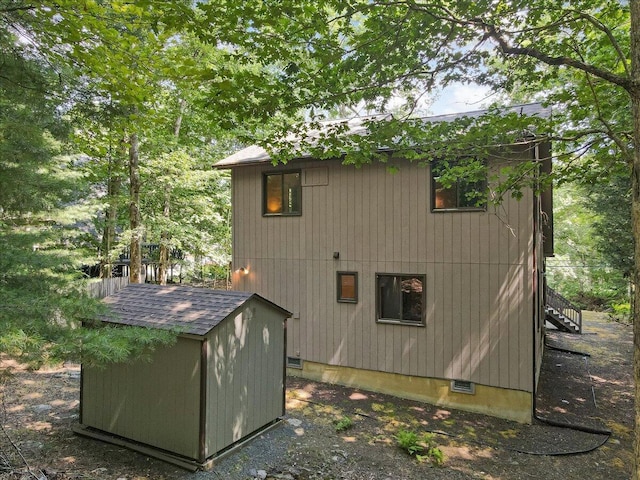 5913 NE Decker Rd NE, Bushkill, PA 18324 - view of side of property with a storage unit and stairs