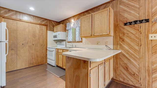 5913 NE Decker Rd NE, Bushkill, PA 18324 - kitchen featuring white appliances, a peninsula, light countertops, light wood-style flooring, and light brown cabinetry