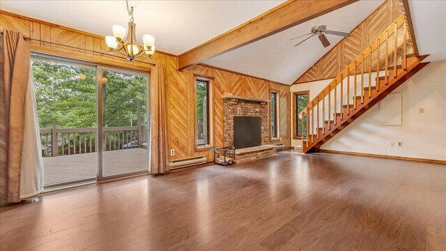 5913 NE Decker Rd NE, Bushkill, PA 18324 - unfurnished living room with wood finished floors, stairway, a baseboard heating unit, a chandelier, and beamed ceiling