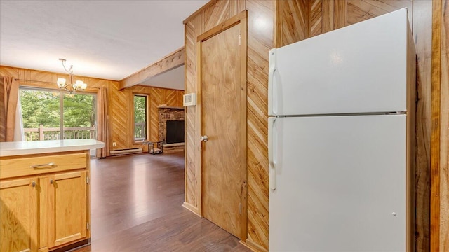 5913 NE Decker Rd NE, Bushkill, PA 18324 - kitchen with freestanding refrigerator, wood walls, a chandelier, dark wood finished floors, and light countertops