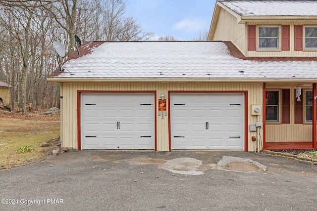 garage featuring driveway