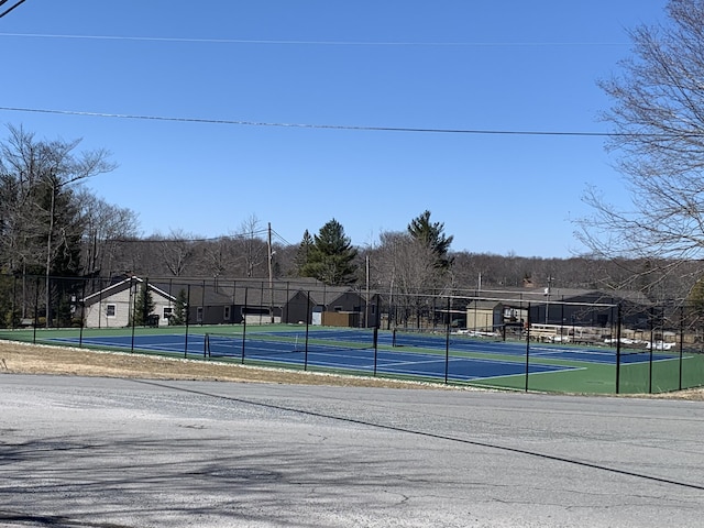 view of sport court with fence