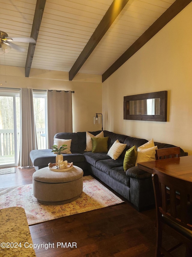 living room featuring vaulted ceiling with beams, a ceiling fan, and wood finished floors