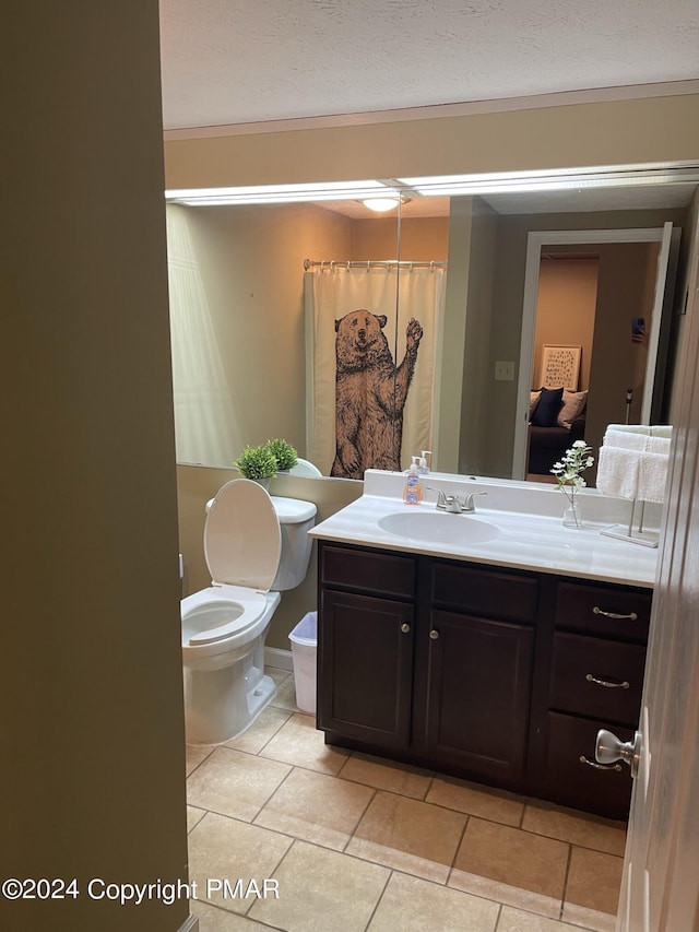 bathroom with a shower with shower curtain, toilet, tile patterned flooring, a textured ceiling, and vanity