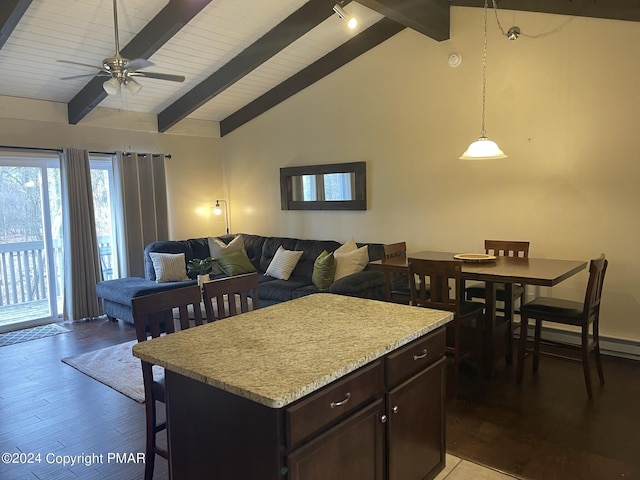 kitchen with vaulted ceiling with beams, open floor plan, dark brown cabinets, light countertops, and light wood finished floors