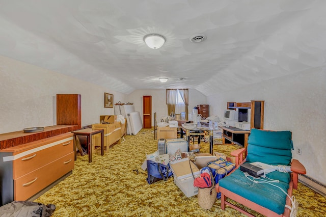 misc room featuring visible vents, carpet floors, vaulted ceiling, baseboard heating, and a textured wall