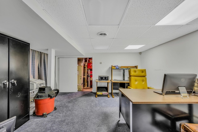 carpeted office with visible vents and a paneled ceiling