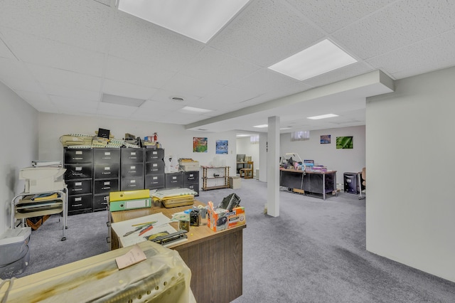 office space featuring a paneled ceiling and carpet