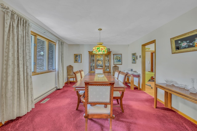 carpeted dining space with baseboards and visible vents