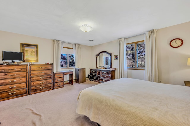 bedroom featuring light colored carpet