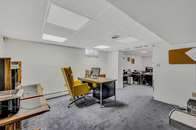 office area featuring carpet flooring, a baseboard heating unit, visible vents, and a drop ceiling