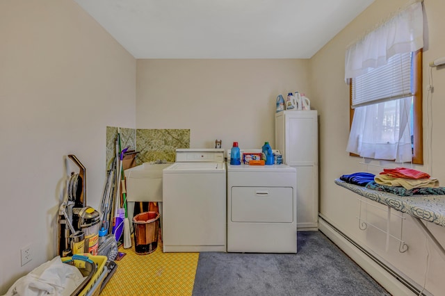 clothes washing area featuring a sink, cabinet space, independent washer and dryer, and a baseboard radiator