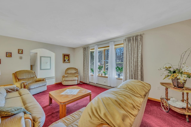 living area with baseboards, arched walkways, carpet floors, and a baseboard heating unit