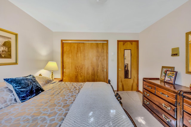 bedroom featuring a closet and carpet flooring