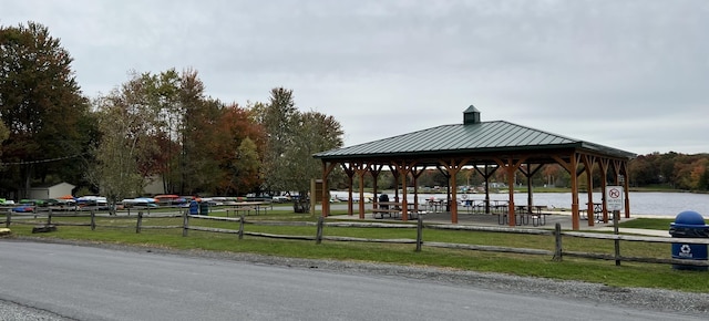 view of home's community featuring a gazebo and fence