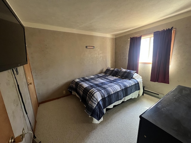 bedroom featuring a baseboard heating unit and carpet