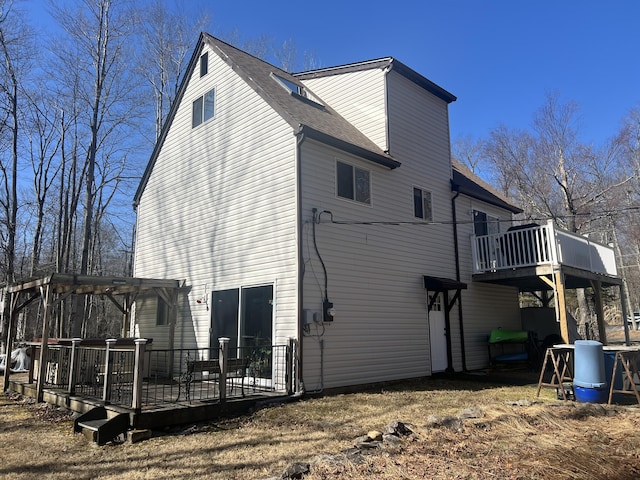 view of side of home with a deck