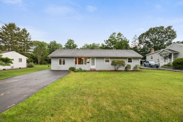 1703 Wallace St, Stroudsburg, PA 18360 - view of front facade with asphalt driveway and a front yard