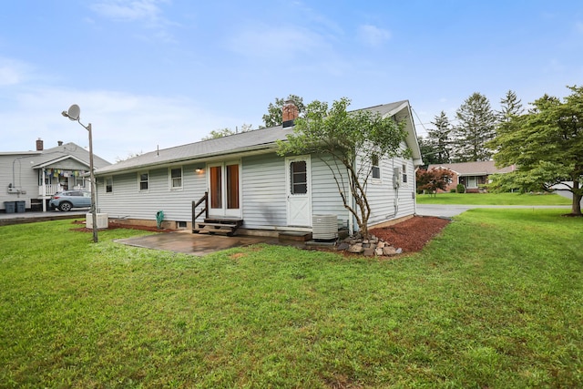 1703 Wallace St, Stroudsburg, PA 18360 - rear view of property featuring entry steps, a yard, a chimney, and a patio area