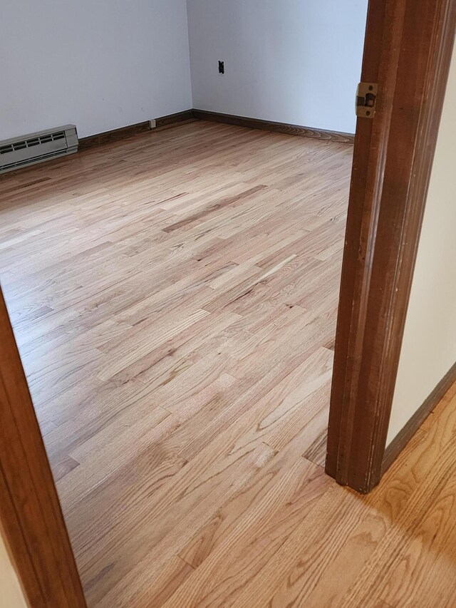 166 Applewood Dr, Swiftwater, PA 18370 - spare room with a baseboard heating unit, carpet flooring, and baseboards
