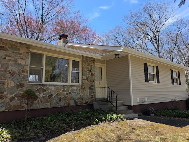 166 Applewood Dr, Swiftwater, PA 18370 - view of front facade with stone siding and a chimney