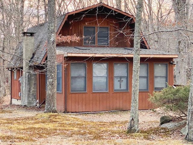 view of home's exterior featuring roof with shingles