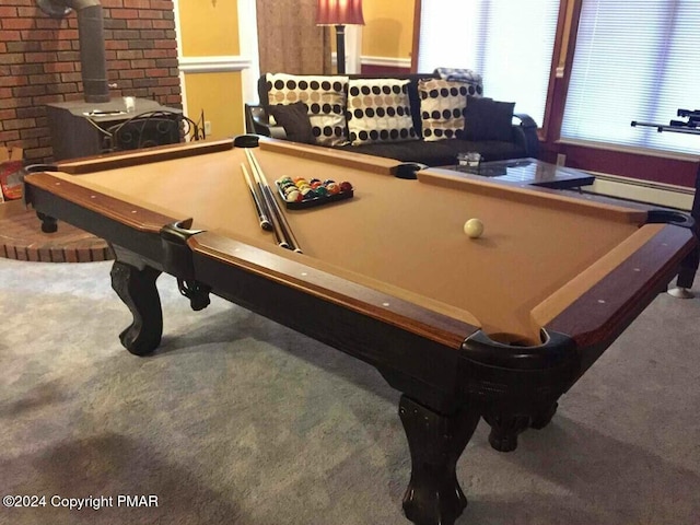 rec room featuring carpet floors, billiards, and a wood stove