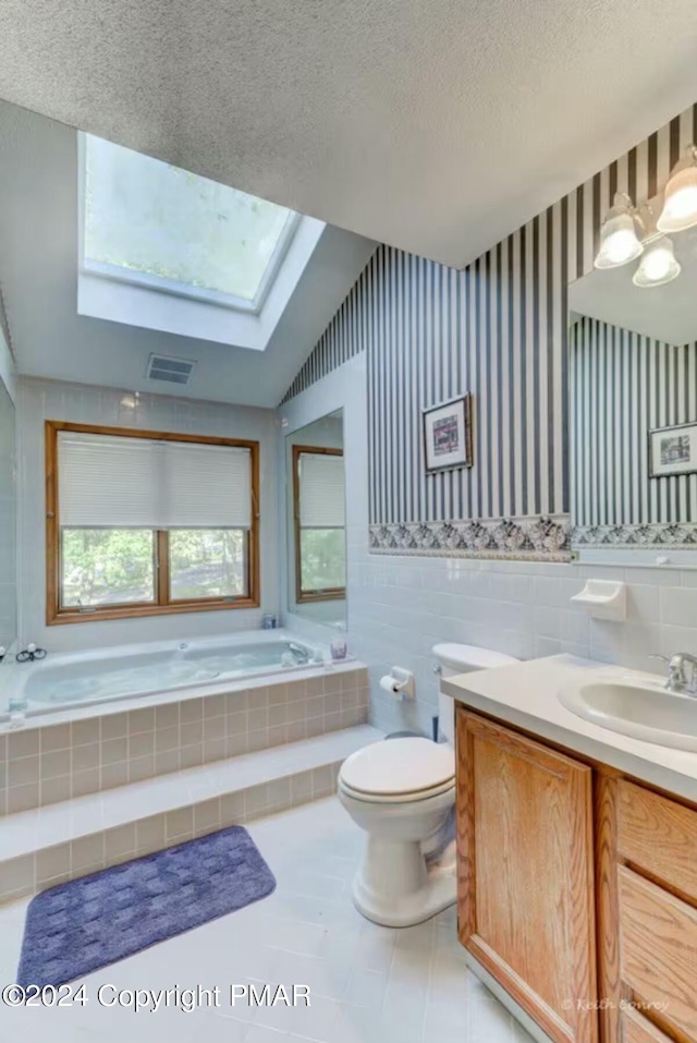 full bath featuring tile walls, visible vents, wallpapered walls, a textured ceiling, and a bath