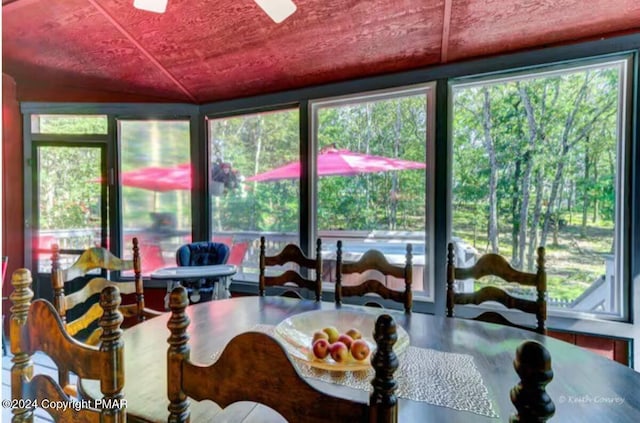 dining area featuring vaulted ceiling