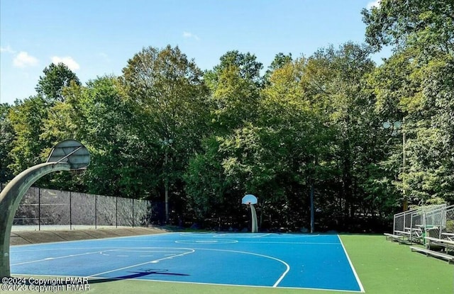 view of sport court featuring community basketball court and fence