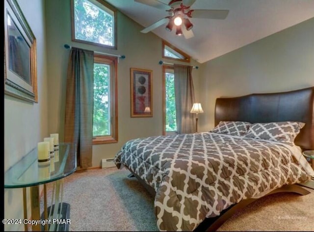 carpeted bedroom with a baseboard heating unit and lofted ceiling