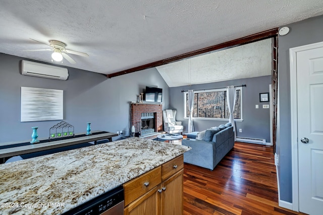 kitchen featuring lofted ceiling, a wall unit AC, dark hardwood / wood-style floors, a fireplace, and a baseboard radiator