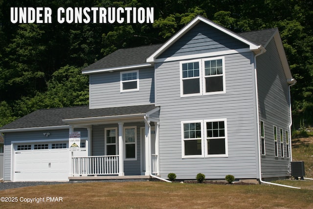 traditional home with cooling unit, a front yard, a porch, and an attached garage