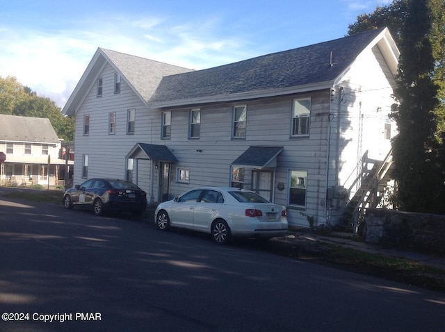 view of front of house with a shingled roof