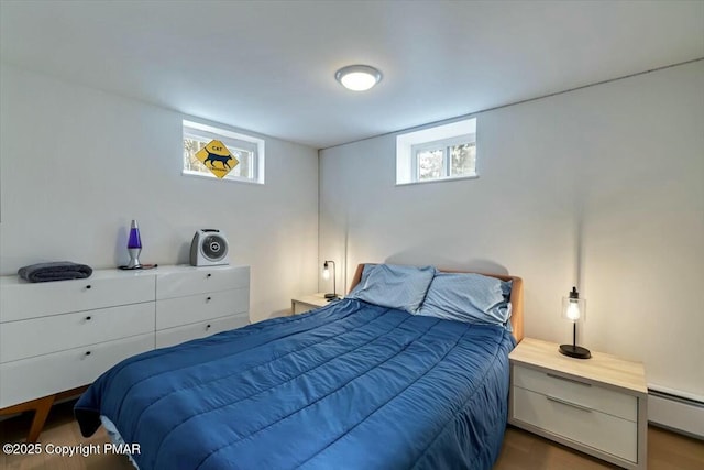 bedroom featuring a baseboard radiator