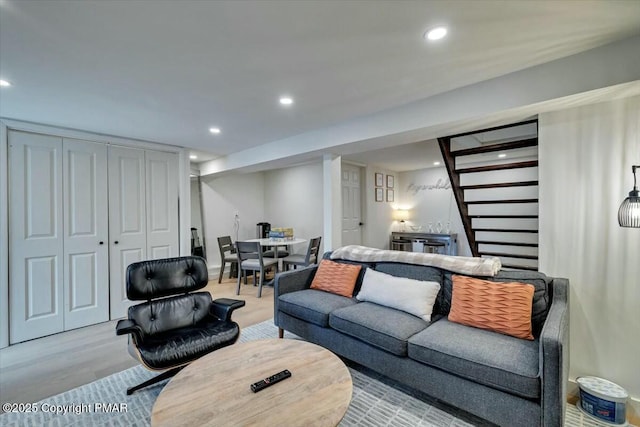 living room with wood finished floors and recessed lighting