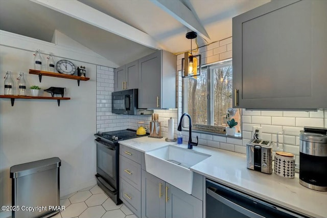 kitchen with vaulted ceiling with beams, gray cabinets, decorative backsplash, a sink, and black appliances