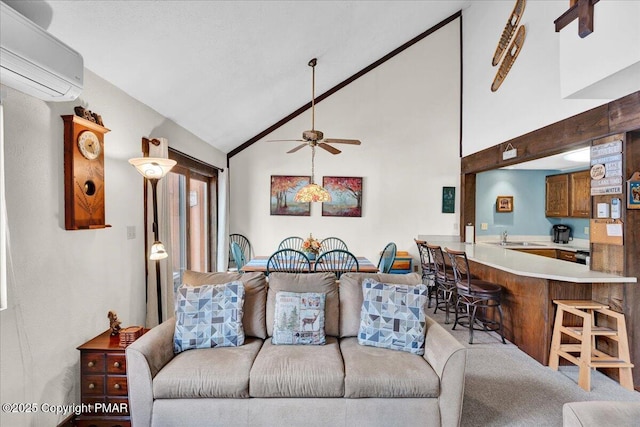 living room featuring a ceiling fan, vaulted ceiling, and a wall mounted AC