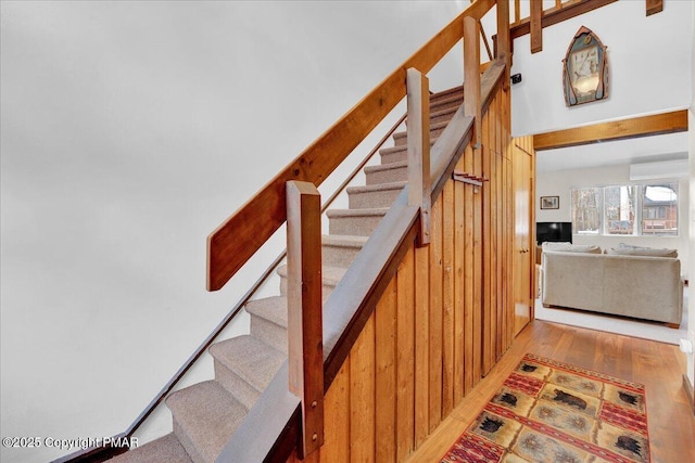 stairs with wood finished floors