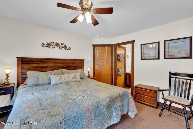 bedroom featuring carpet flooring, ceiling fan, and ensuite bath