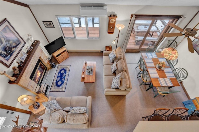 101 Ruffed Grouse Ct, Lake Harmony, PA 18624 - living area featuring a wall mounted AC, a baseboard radiator, a glass covered fireplace, and baseboards